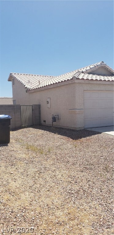 Left side of property.