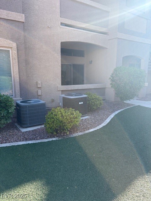View of home's exterior with a cooling unit and st