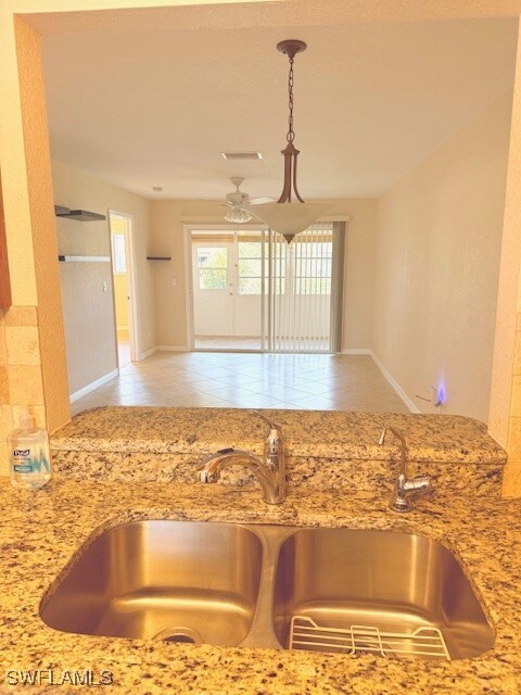 Kitchen looking at dining/living room with hanging