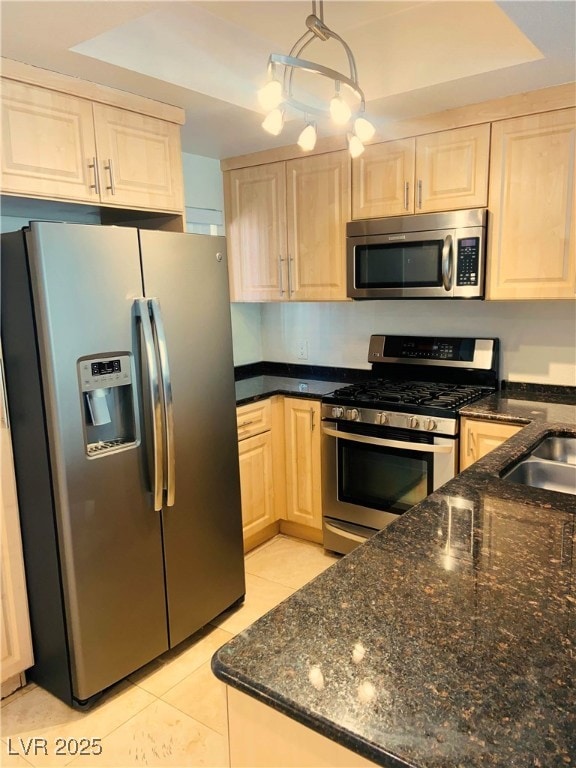 Kitchen with stainless steel appliances, light bro