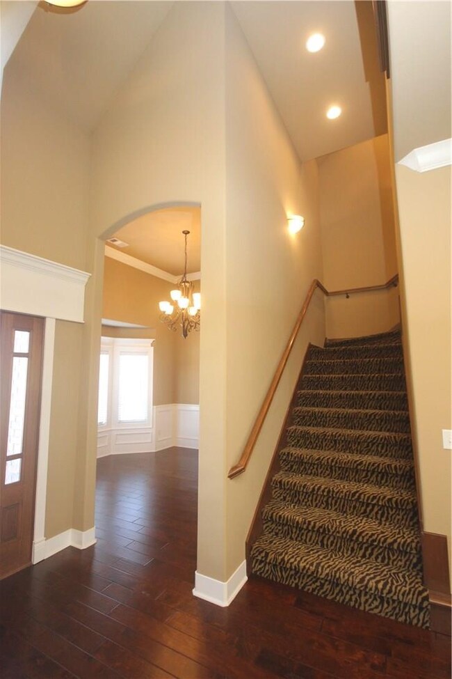 Foyer Entrance with stairs/formal dining room to t