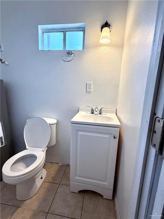 Bathroom featuring vanity and tile patterned flooring