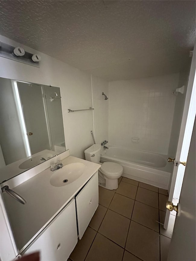 Bathroom with vanity, shower / washtub combination