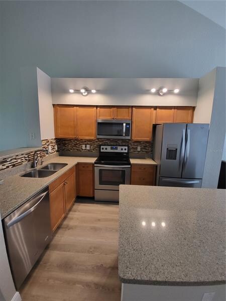 Kitchen has new lighting, SS appliances all within 4 years...range and micro within a year ....quartz counter tops