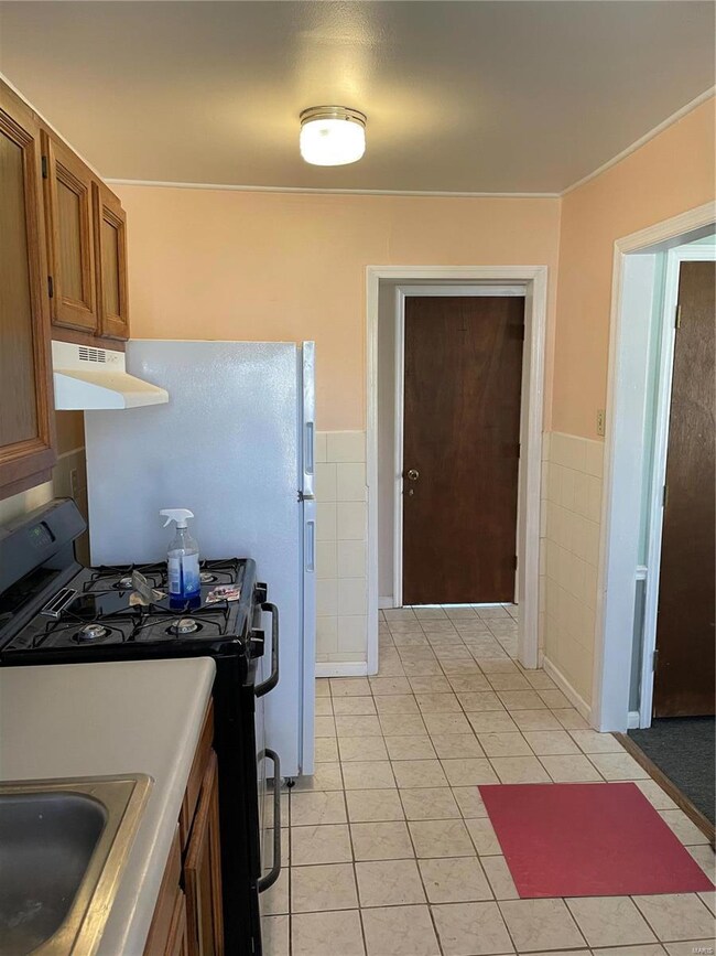 The Living Room is located to the right of Kitchen