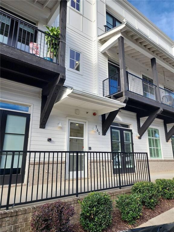 Entrance to property featuring a balcony