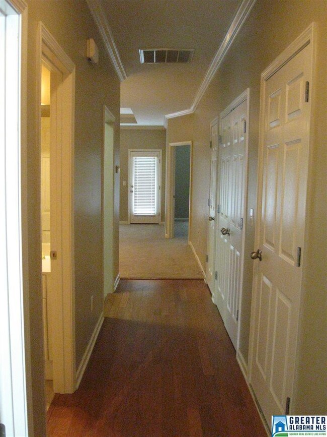 WOOD LAMINATE FLOORING IN ENTRY AND HALL
