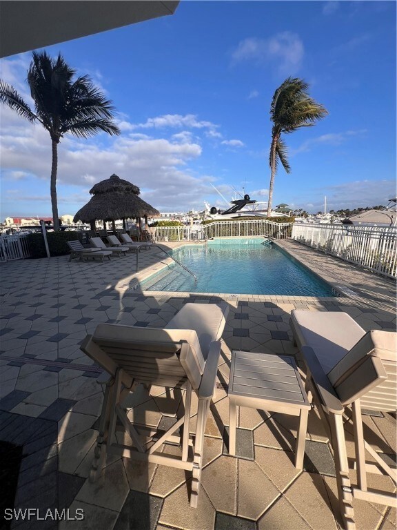 View of pool featuring a gazebo and a patio