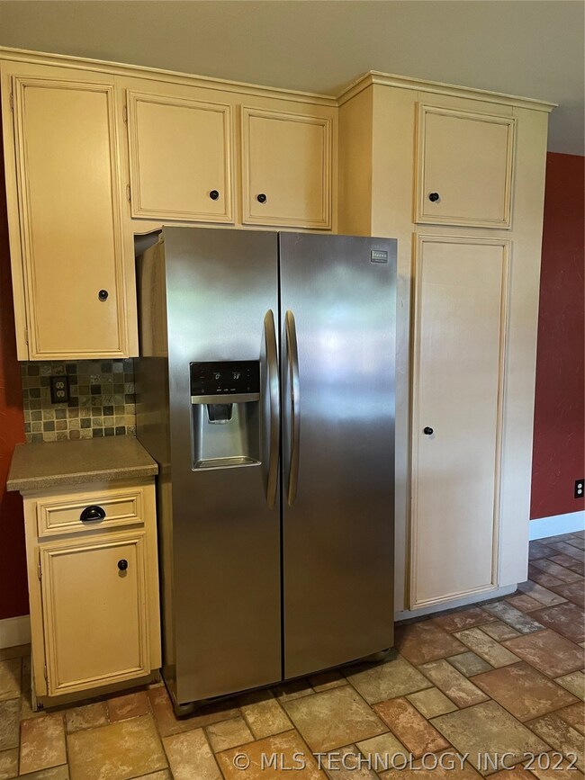 Stainless refrigerator and a nice sized pantry jus