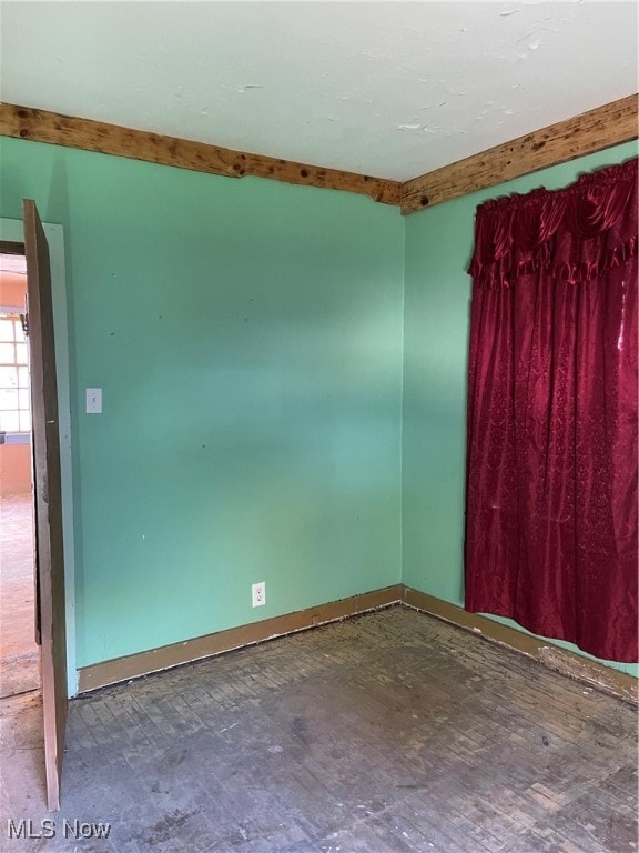 Unfurnished room with baseboards