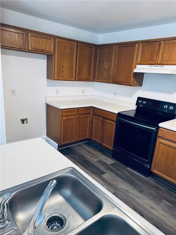Kitchen featuring black / electric stove, under ca