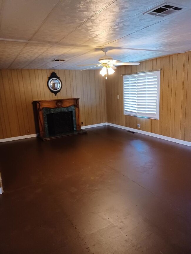 livingroom has a free standing fireplace