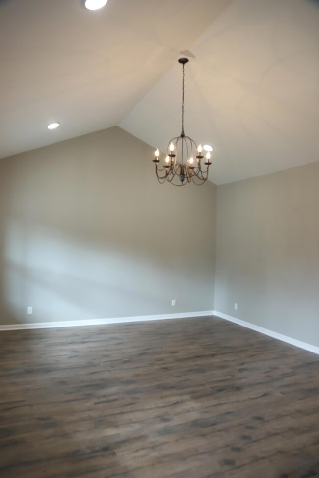 living room with vaulted ceilings