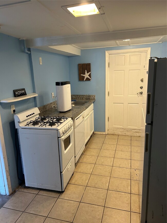Large kitchen with door to utility room