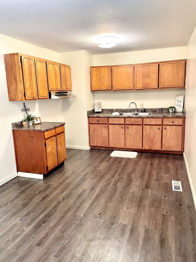 Kitchen w wood cabinets