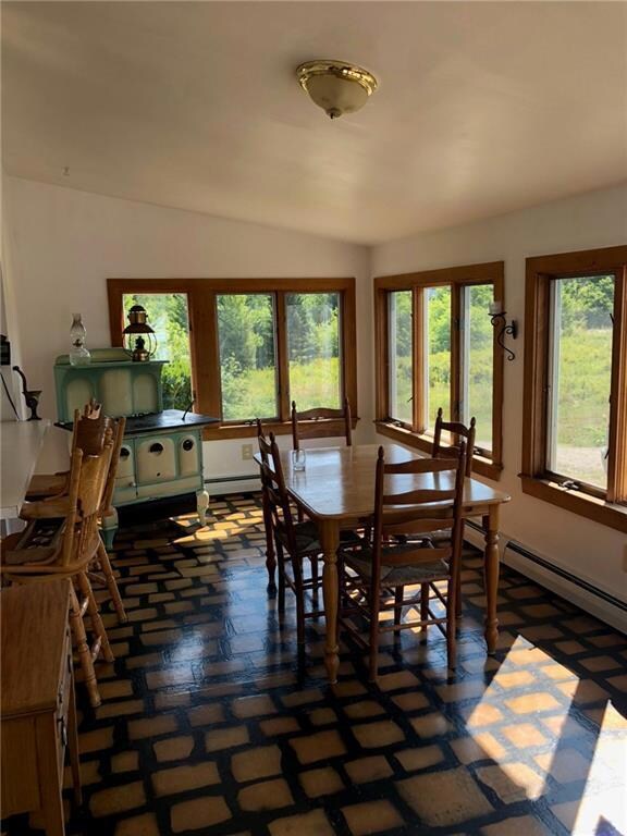 Dining area with counter looking...