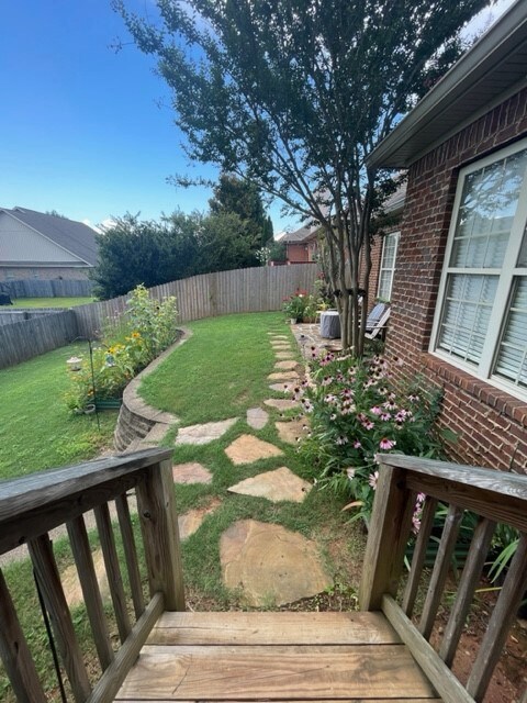 Stairs off deck to stone walk way