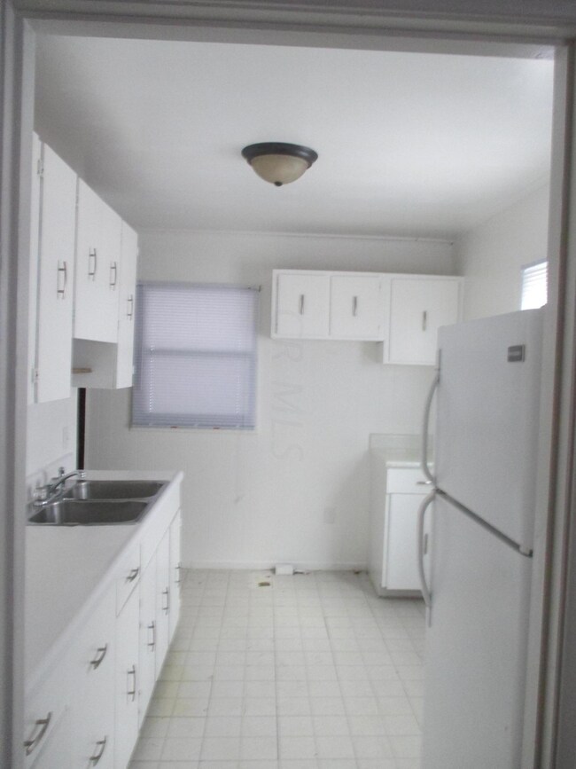 Kitchen with refrigerator