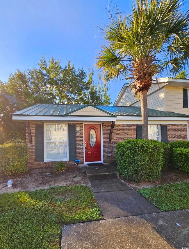 View of front of home with brick siding