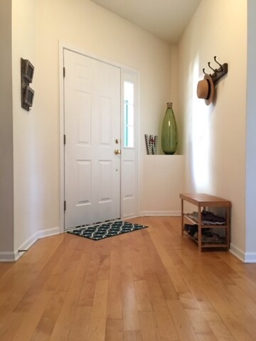 Welcoming foyer leads to all hardwood first floor!