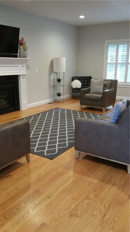 Formal living room with hardwood floors, gas firep