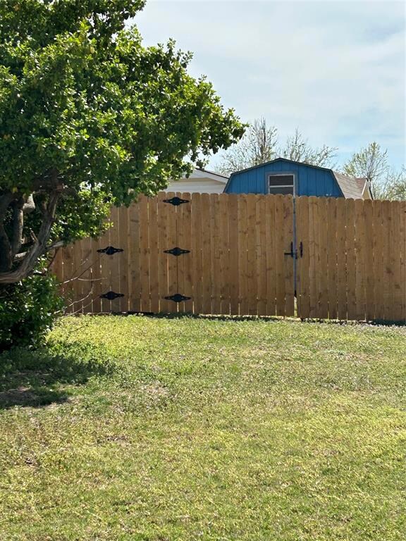 View of yard featuring fence