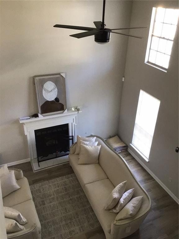 Living area with a fireplace, wood finished floors