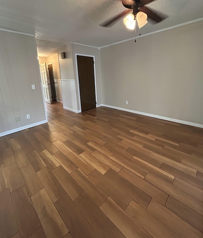 Unfurnished room featuring dark wood-type flooring