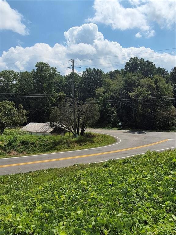 View of community featuring view of wooded area