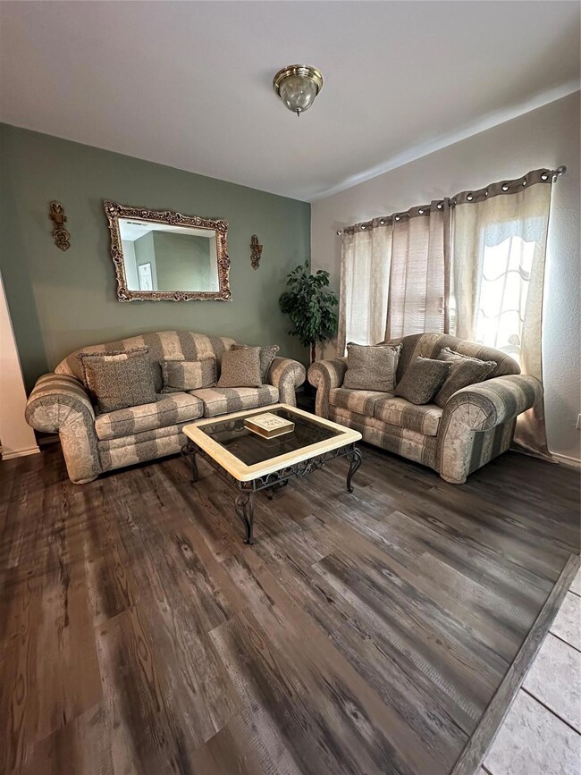 Living room featuring dark hardwood / wood-style f