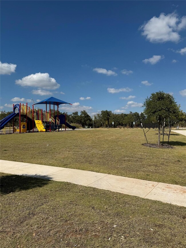 Community playground with a lawn