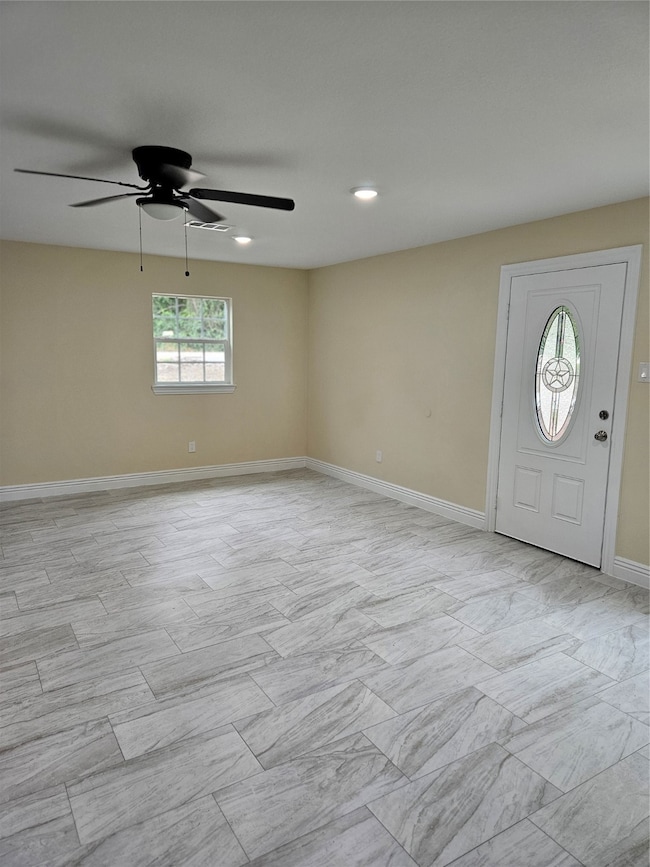 Foyer entrance with recessed lighting and a ceiling fan
