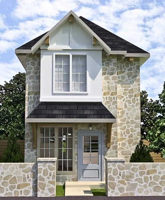 View of front facade featuring stone siding and s
