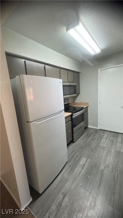 Kitchen featuring appliances with stainless steel