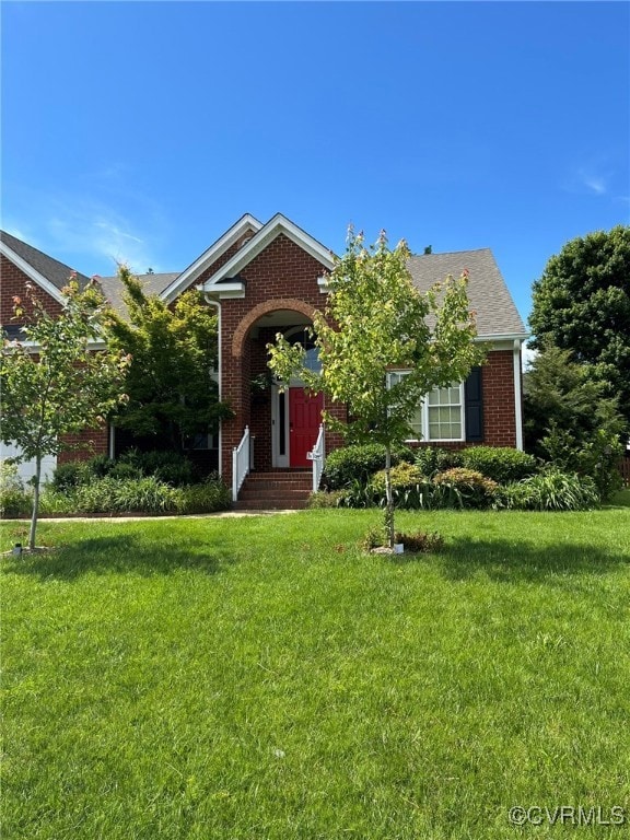 View of front of home with brick siding and a fron