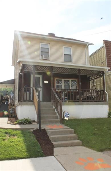A welcoming front porch is the perfect place to gr