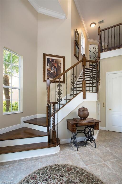 Wood stairs with wood and iron railing