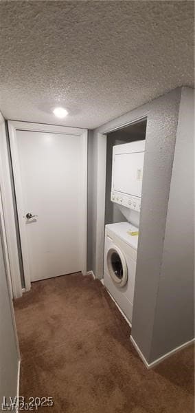 Laundry area featuring stacked washer / drying mac