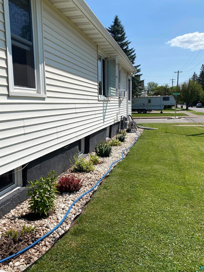 View of home's exterior with a lawn