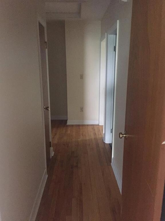 Hallway leading to bedrooms and 2 baths