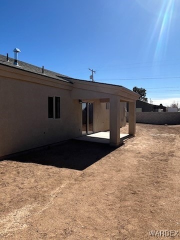 Rear view of property with a patio