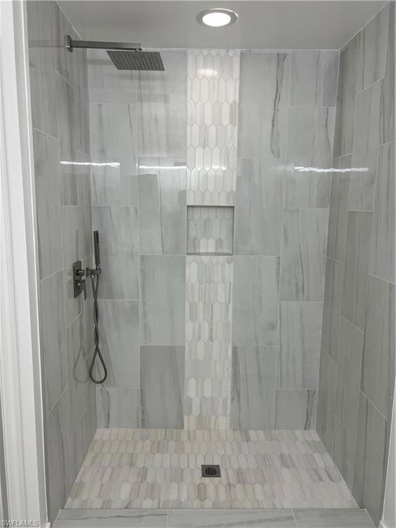 Bathroom with a tile shower