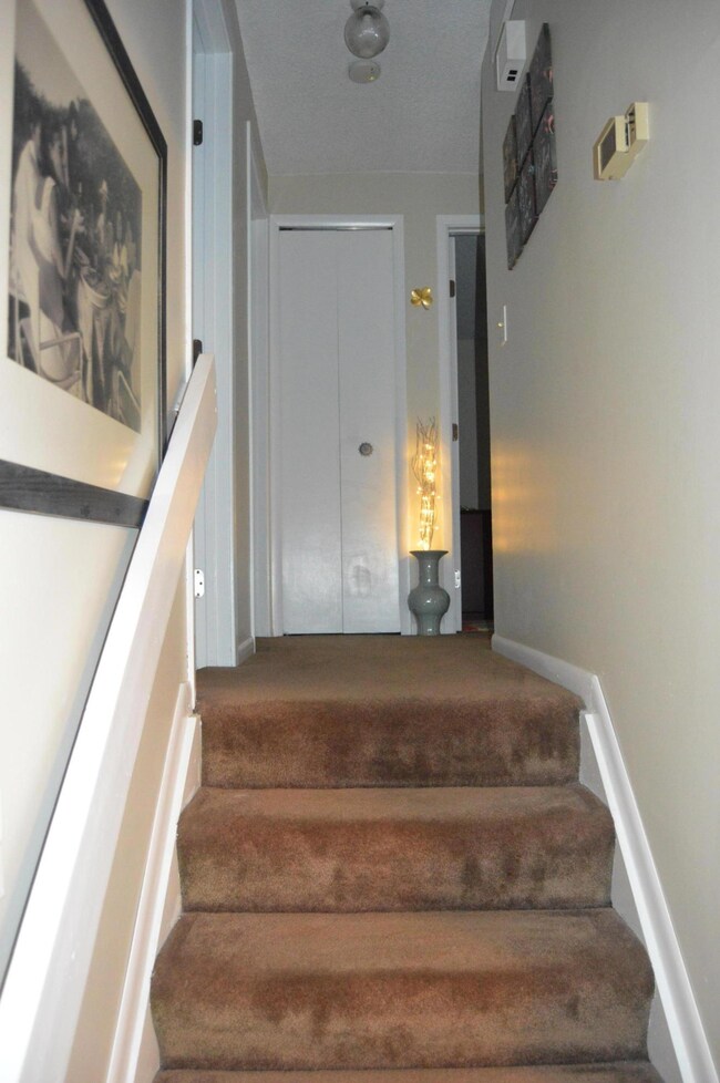 Stairs to upper 3 bedrooms