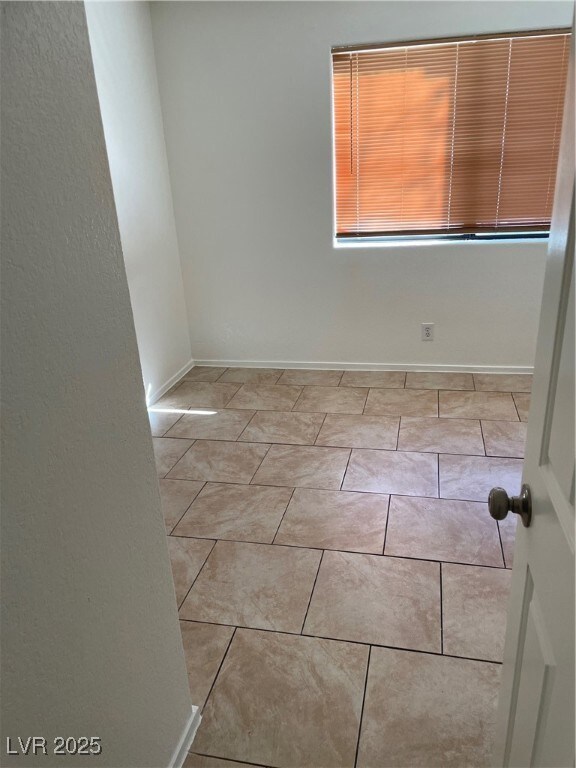 Spare room with baseboards