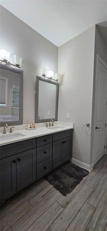 Full bathroom with wood finished floors, double va