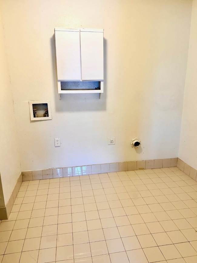 Spare room with light tile patterned floors