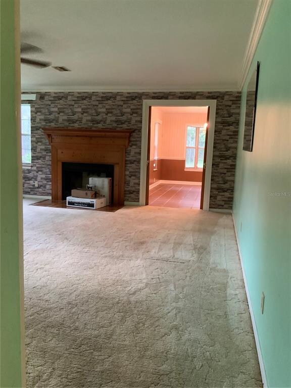 Looking across living room into dining room