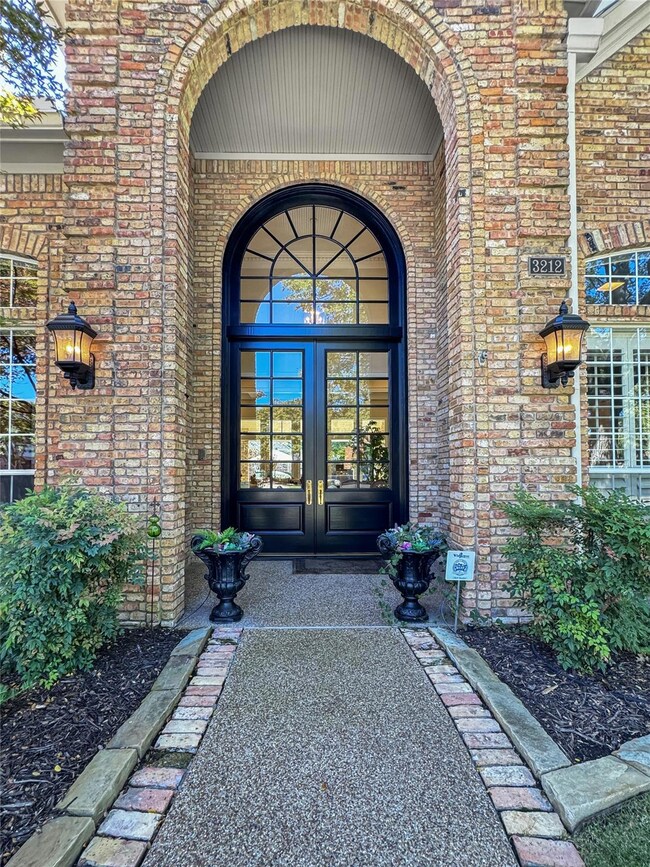 Impressive front entrance features a grand doorway