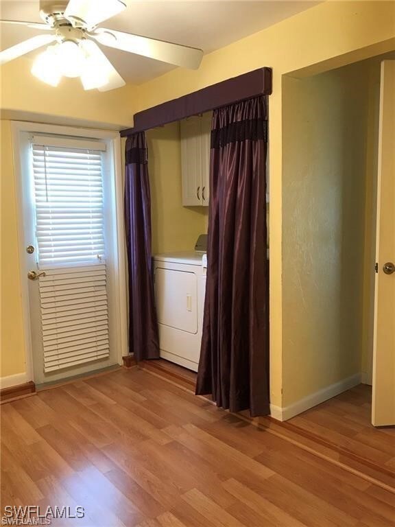 Empty room with light hardwood / wood-style floori