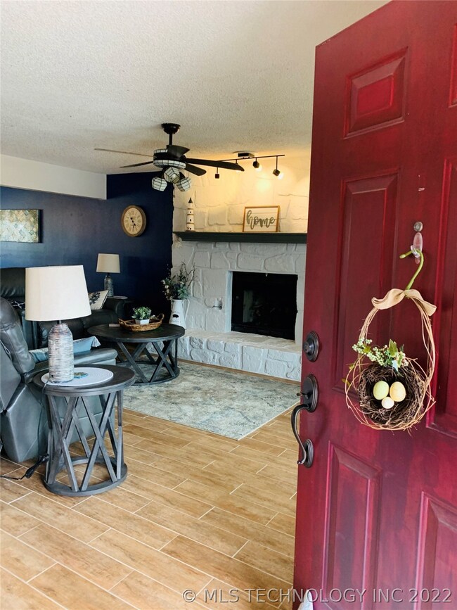 A nice looking red door gives a warm welcome into